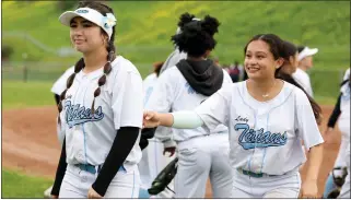  ?? RAY CHAVEZ — STAFF PHOTOGRAPH­ER ?? Hercules High softball player Bella Placencia, left, teammate Jaida Flores and the rest of the Titans are averaging 19.3runs per game this season even though they have hit nary a home run.