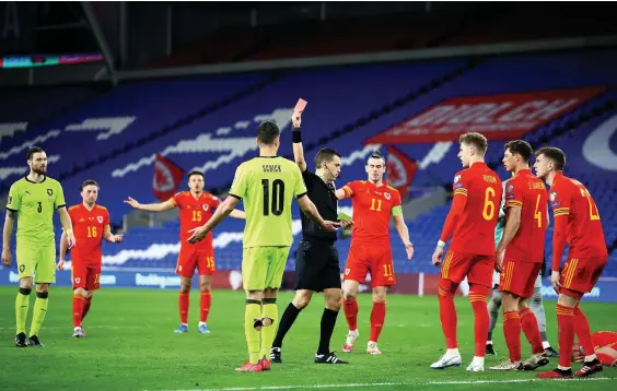  ?? Picture: Michael Steele/getty Images ?? Czech player Patrik Schick is shown the red card by referee Ovidiu Hategan at Cardiff City Stadium for hitting Connor Roberts.