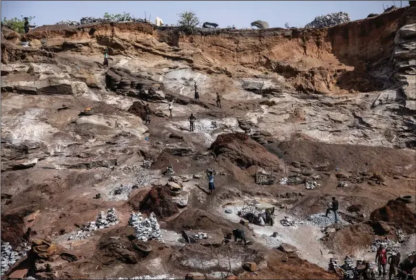  ?? (AP/Sophie Garcia) ?? People work April 27 in a granite mine on the outskirts of Ouagadougo­u, Burkina Faso.