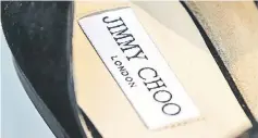  ??  ?? A label stitched into a shoe inside a store of the luxury shoe maker Jimmy Choo in London on Apr 24.