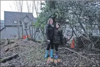  ?? 08_a07robbden­04 ?? Donna Galbraith with daughter Ella, in Robber’s Den behind their home.