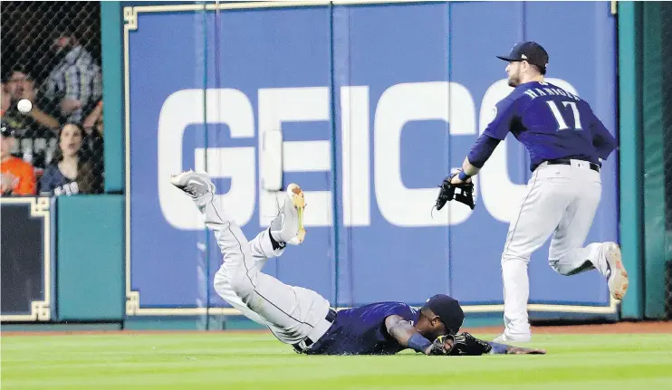  ?? — THE ASSOCIATED PRESS ?? Mariners centre-fielder Guillermo Heredia falls after trying to make a diving catch during the Astros’ 8-6 victory over Seattle Saturday in Houston.