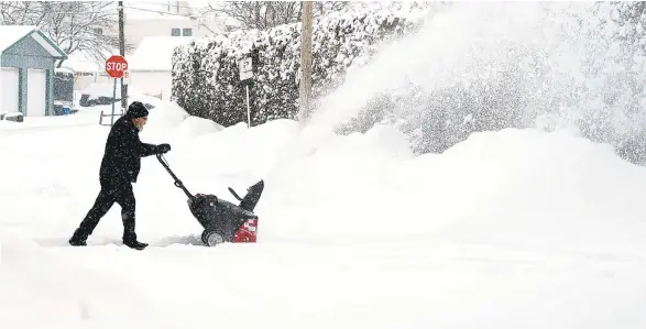  ?? AMY SHORTELL / THE MORNING CALL ?? A resident works to clear Ridge Alley in Northampto­n during Monday’s winter storm.