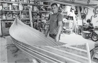  ?? GLEN WHIFFEN • THE TELEGRAM ?? Scott Mcdonald of St. John’s works on a cedar canoe he is building for future adventures in the country with family and friends.