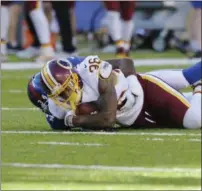  ?? BILL KOSTROUN — ASSOCIATED PRESS ?? Redskins defensive back Su’a Cravens is tackled by Giants’ Shane Vereen (34) after intercepti­ng an Eli Manning pass.