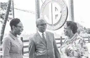  ??  ?? Councillor Norman Scott (centre), mayor of Spanish Town, in discussion with Bishop Jacqueline McCullough (right) of the Word Alive outreach ministry, and Rochelle Cameron (left), assistant vice-president, HRD & PR, Jamaica Broilers Group, following a...