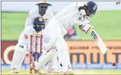  ?? AFP ?? Abhinav Mukund (R) plays a shot in Galle on Friday