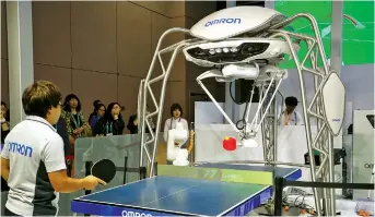  ??  ?? Omron is exhibiting its fourth-generation, ping-pong-playing Forpheus robot.