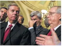  ?? Drew Angerer / Getty Images ?? Sens. Lindsey Graham, left, Bill Cassidy, center, and Majority Leader Mitch McConnell said they “haven’t given up on changing the American health care system.”