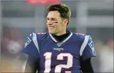  ?? CHARLES KRUPA/AP PHOTO ?? In this Jan. 4 file photo, New England Patriots quarterbac­k Tom Brady walks on the field before an AFC wild-card playoff game against the Tennessee Titans in Foxborough, Mass.