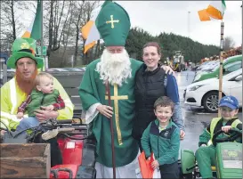  ?? (Photo: Katie Glavin) ?? Sean, Shauna, Sean Óg, Caelum and Darragh Hennessy pictured with St Patrick (William Murphy) last Thursday.