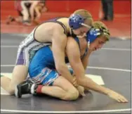  ?? Photo by Barry Taglieiber ?? Phoenixvil­le’s Mark Cermanski controls Oley’s Eric Wily during their 126-pound bout on Saturday.