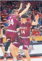  ?? JIM THOMPSON/JOURNAL ?? Valley’s Jesse Murphy (34) and Garret Mosley celebrate their semifinal victory over Silver in Class 4A boys.