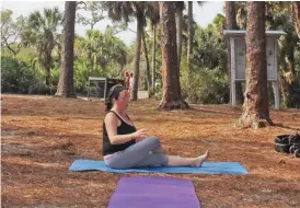  ??  ?? Koreshan's tranquilit­y is ideal for yoga, allowing practition­ers such as Geva Salerno (below left) the peace of isolation to focus on the functional­ity of the mind and senses.