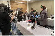  ?? (Special to The Commercial/University of Arkansas System Division of Agricultur­e) ?? A camera crew interviews Grant County 4-H members Daley Rogers, Dylan Rogers, Klaesy Knoefler and Acacia Searcy at the Mid-South Food Pantry Competitio­n in Memphis on Feb. 25. This team, Slice Slice Babies, won 5th place.