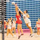  ?? Photo / Michael Bradley ?? Liza Ball (right) in action during the final against St Margaret’s College at the NZSS netball champs.