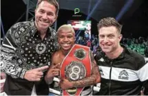  ?? ?? KING OF THE RING: Promoter Eddie Hearn, left, and trainer Colin Nathan celebrate with Sivenathi Nontshinga after he regained the belt