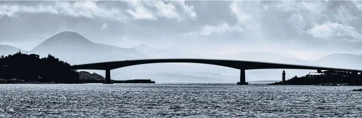  ??  ?? OVER THE SEA TO SKYE: The bridge has been hailed as a vital link, with Transport Scotland figures showing nearly 5,000 journeys over the crossing each day last year.