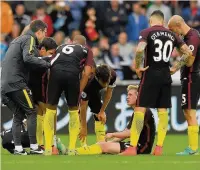  ??  ?? WINCE OF WALES De Bruyne receives treatment