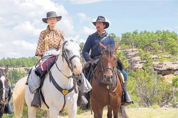  ?? COURTESY OF ENTERTAINM­ENT STUDIOS MOTION PICTURES ?? Rosamund Pike, left, and Christian Bale in a scene from “Hostiles,” which was filmed in New Mexico.