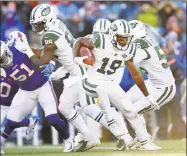  ?? Adrian Kraus / Associated Press ?? The Jets’ Andre Roberts (19) runs with the ball against the Bills on Sunday in Orchard Park, N.Y.