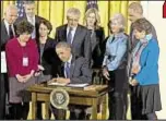  ??  ?? President Obama on Wednesday signs order establishi­ng a task force to assist schools in combatting sexual violence on college campuses.