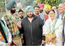  ??  ?? Punjab MLAS Mahesh Inder Singh (L) and Rajvinder Kaur (R) with Punjab Pradesh Congress president Capt Amrinder Singh after joining Congress in New Delhi