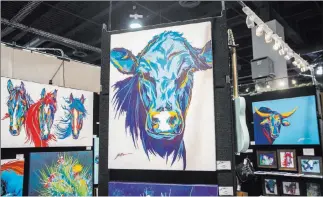  ?? Benjamin Hager Las Vegas Review-Journal ?? Lyndon Gaither’s contempora­ry Western art features brightly colored cows, horses and cactuses.