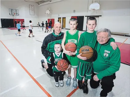 ?? JULIE JOCSAK THE ST. CATHARINES STANDARD ?? Kevin McKenna Sr. and Kevin McKenna Jr. are photograph­ed with the next generation, from left, Kyrie, 2, Joshua, 11, and Kian, 9, during a recent basketball practice in St. Catharines.