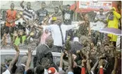  ?? Picture: REUTERS/ LUC GNAGO ?? HOME AGAIN: Charles Ble Goude, former youth minister for former president Laurent Gbagbo and leader of the Young Patriots, greets supporters on his return after being released by the Internatio­nal Criminal Court in Abidjan, Ivory Coast.