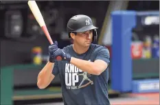  ?? David Dermer / Associated Press ?? Yankees' Kyle Higashioka take part in batting practice before Tuesday’s Game 2 against the Rays in San Diego.