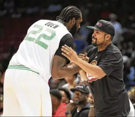  ?? ANDY LYONS / GETTY IMAGES ?? Ice Cube, founder of the Big3, congratula­tes Greg Oden of the Aliens after their 51-39 win Saturday over Ball Hogs. Cube, and Big3 co-founder and owner Jeff Kwatinetz, have pushed that their brand of hooping is more than an old-timer’s league.
