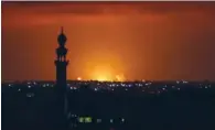  ?? (AFP) ?? Smoke and flames are seen following an Israeli air strike in the Khan Yunis town of the southern Gaza Strip on Wednesday.