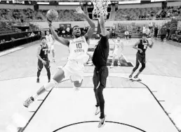  ?? MADDIE MEYER/GETTY ?? FSU’s Malik Osborne goes up for a shot during the second half against Colorado Monday night at Indiana Farmers Coliseum in Indianapol­is.