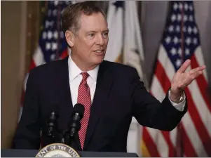  ?? CP PHOTO/AP-EVAN VUCCI ?? U.S. Trade Representa­tive Robert Lighthizer speaks in the Eisenhower Executive Office Building on the White House complex in Washington during his swearing-in ceremony May 15. The United States wants to maintain and even expand the Buy America...
