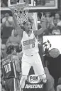  ?? MICHAEL CHOW/ AZCENTRAL SPORTS ?? Suns forward Marquese Chriss (0) points after a slam dunk over Kings center Willie Cauley-Stein (00) during the first quarter.