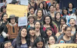  ?? Sashenka Gutierrez European Pressphoto Agency ?? AT A PROTEST over violence against women, demonstrat­ors shout slogans at the Mexico City campus of the National Autonomous University of Mexico.