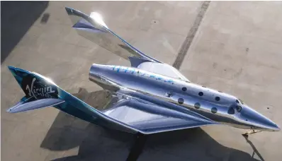  ?? COURTESY VIRGIN GALACTIC ?? The VSS Imagine, the first SpaceShip III in the Virgin Galactic Fleet, in Mojave, Calif. Virgin Galactic rolled out its newest spaceship Tuesday as the company looks to resume test flights in the New Mexico desert.