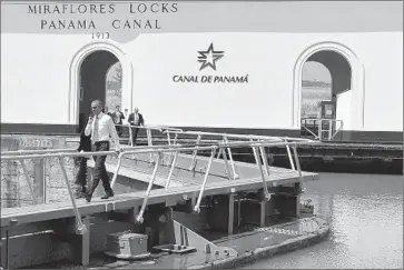  ?? Mandel Ngan
AFP/Getty Images ?? PRESIDENT OBAMA VISITS the Panama Canal, which he cited as a symbol of the integratio­n needed for Latin American prosperity. Maduro, for his part, pointedly met with survivors of the 1989 U.S. invasion.