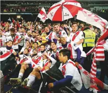  ?? AP ?? River Plate’s players celebrate after emerging winners in the Copa Libertador­es at the Santiago Bernabeu stadium.