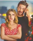  ?? NETFLIX ?? Emma Roberts, left, and Luke Bracey spend the holidays as platonic friends in Holidate.