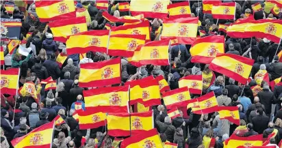  ?? PHOTO: REUTERS ?? Show of colours . . . People gather during a protest called by rightwing opposition parties against Spanish Prime Minister Pedro Sanchez at Colon square in Madrid, Spain, early yesterday.