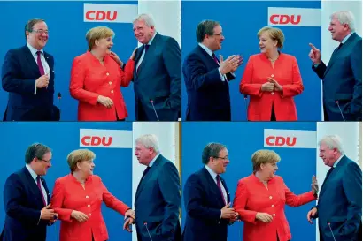  ?? AFP ?? German Chancellor Angela Merkel talking with Hesse’s State Premier and deputy chairman of the Christian Democratic Union (CDU) Volker Bouffier (R) and North Rhine-Westphalia’s State Premier and deputy chairman of the Christian Democratic Union (CDU)...