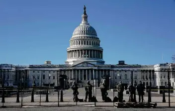  ?? Todd Heisler / New York Times ?? Security fences have been erected around the Capitol complex in the wake of an attack on the building by a mob seeking to overturn the election defeat of President Donald Trump.