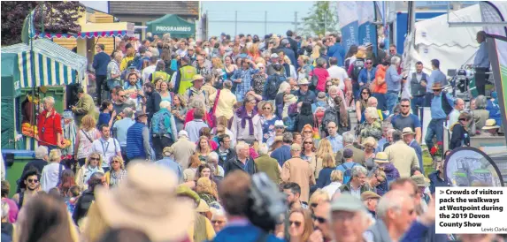  ?? Lewis Clarke ?? > Crowds of visitors pack the walkways at Westpoint during the 2019 Devon County Show