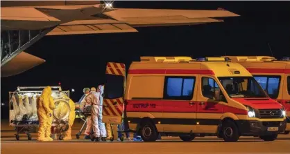  ??  ?? Coronaviru­s patients from Italy arrive at Leipzig/Halle airport by Italian air force military plane on Tuesday 24 March. Photograph: Peter Endig /AP