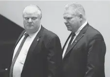  ?? MICHAEL PEAKE/FILES ?? PC Leader Doug Ford, right, flanked by late brother Rob, writes in his recent book that mayors of all political stripes have been thwarted by Toronto councillor­s.