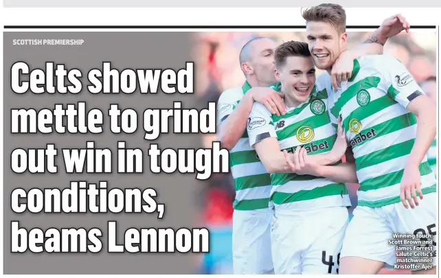  ??  ?? Winning touch: Scott Brown and James Forrest salute Celtic’s matchwinne­r Kristoffer Ajer