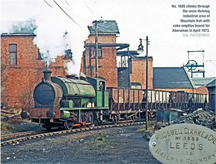  ?? RAIL PHOTOPRINT­S ?? No. 1885 climbs through the once-thriving industrial area of Mountain Ash with coke empties bound for Aberaman in April 1973.