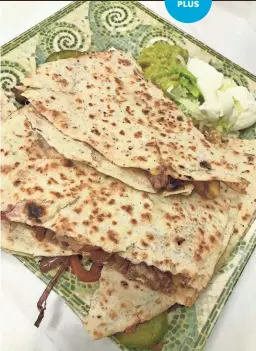  ?? TIRION MORRIS ?? The fajita quesadilla is filled with onions, red and green peppers, cheese and choice of meat. Thick chunks of perfectly cooked steak fill this one at Caminero Mexican Restaurant.